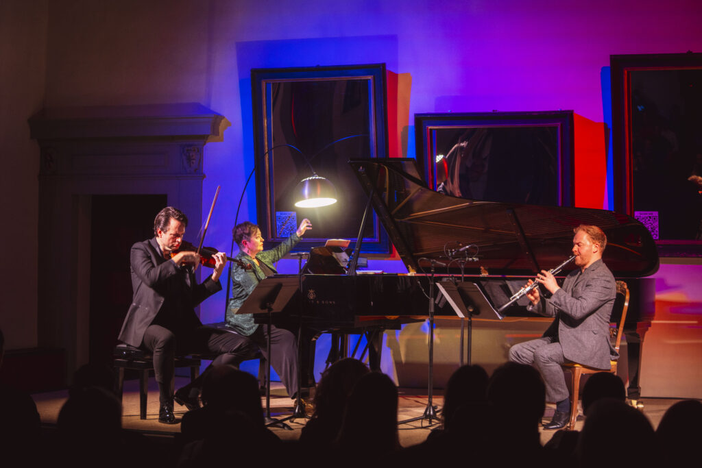 Trio Mascarade performing in the concert hall of Palazzo Corsini in Florence