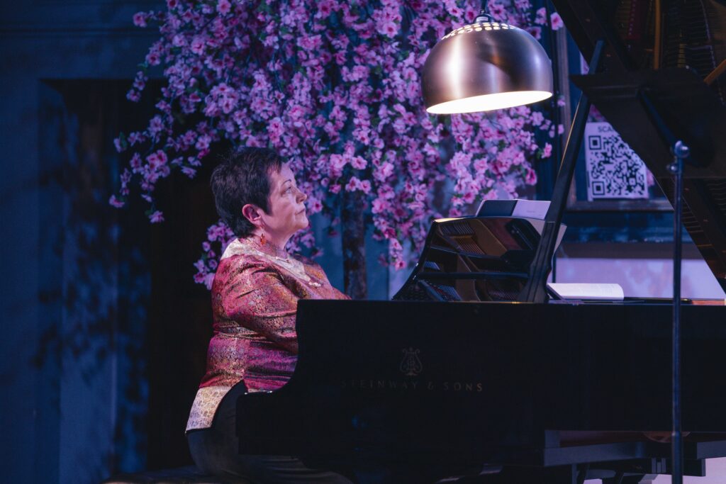 Julia Lynch, artistic director of Mascarade Opera, at the piano
